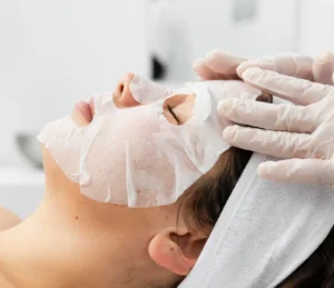a client undergoing a facial treatment at Bare Beauty Laser and Aesthetics Medical spa